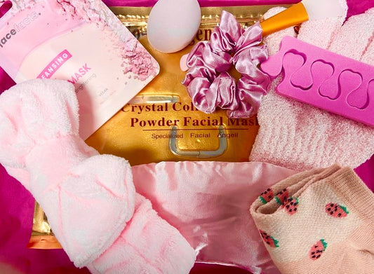Assorted skincare and beauty products for The Soap Gal x Women’s Night In Pamper Self Care Letterbox Gift Set with plush slippers on a golden background.