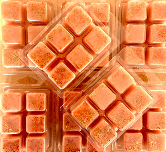 Several plastic clamshell packs containing Sticky Toffee Pudding Wax Melt by The Soap Gal x are arranged closely together.