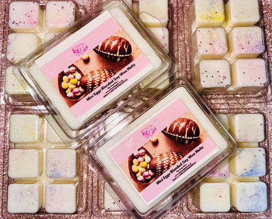 A set of Chocolate Egg Easter scented wax melts by The Soap Gal x on a pink background.