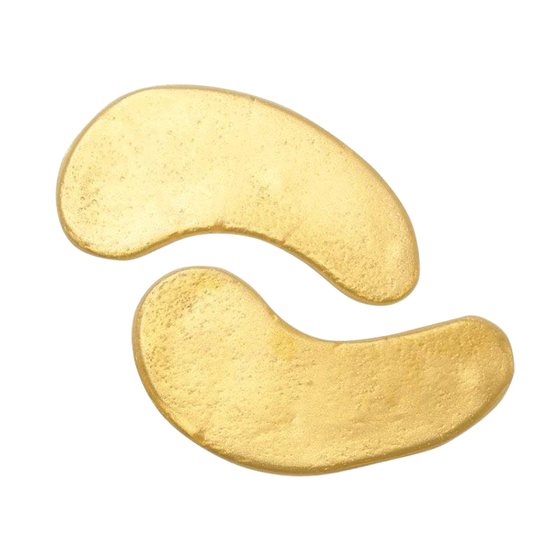 Two unshelled cashew nuts accompanied by The Soap Gal x Gold Under Eye Gel Patches on a white background.