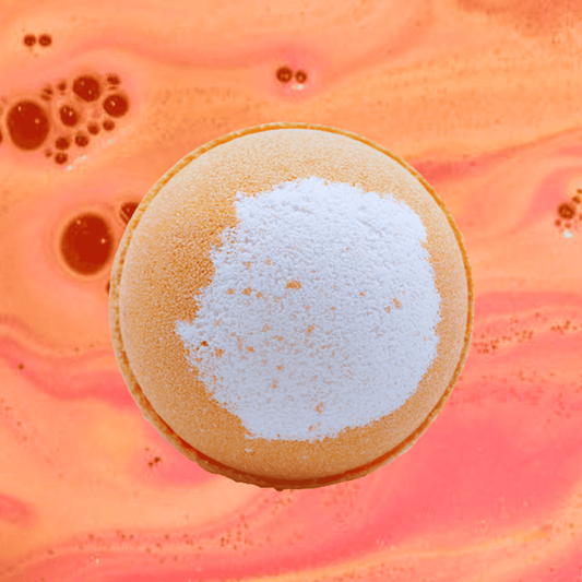 A pancake with a mound of powdered sugar on top, set against an abstract pink and orange swirled background reminiscent of a Bucks Fizz Bath Bomb from The Soap Gal x.