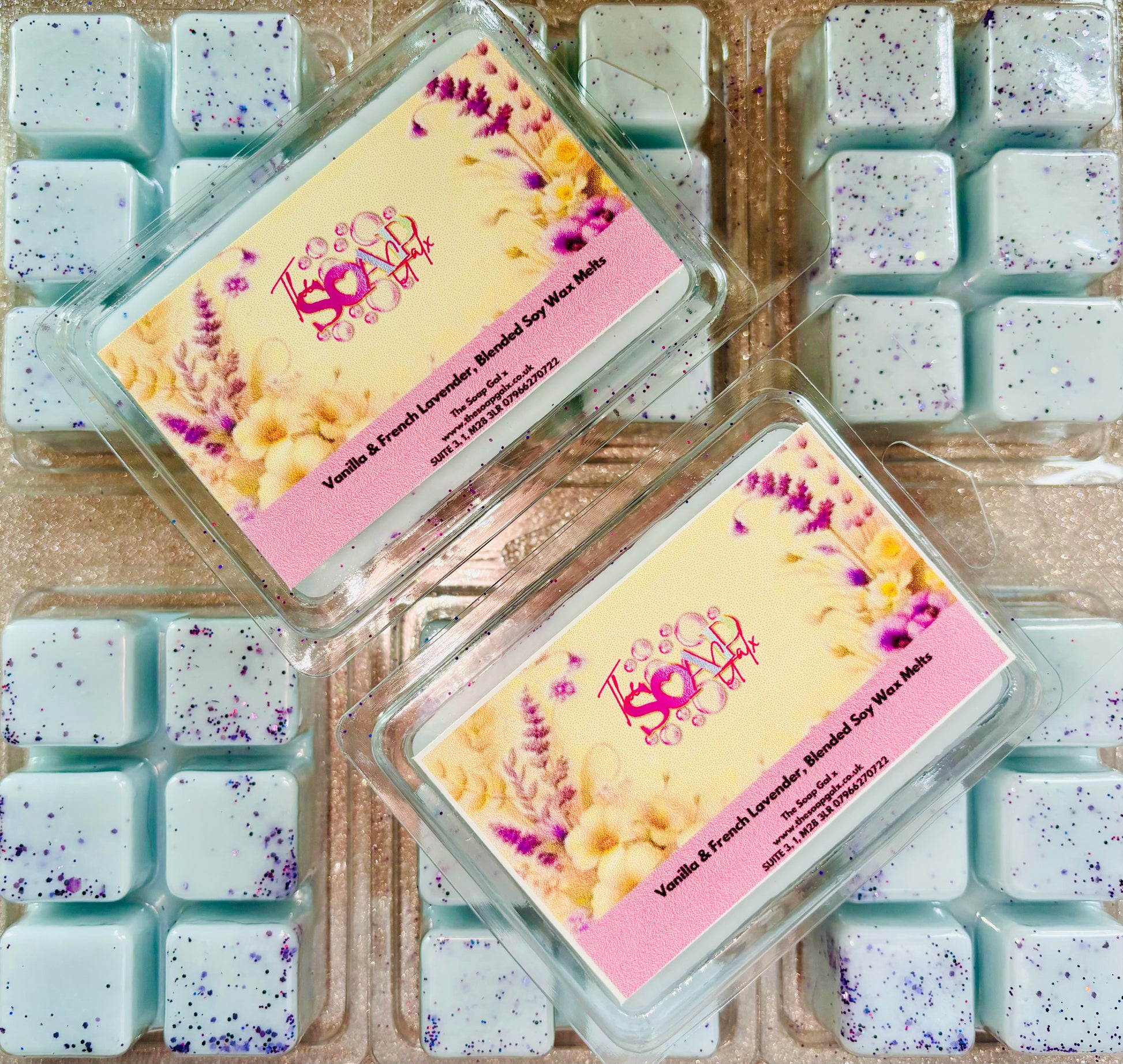 Two boxes of handmade vegan soap displayed among various other soap pieces, including The Soap Gal x Lavender and Vanilla Wax Melts.