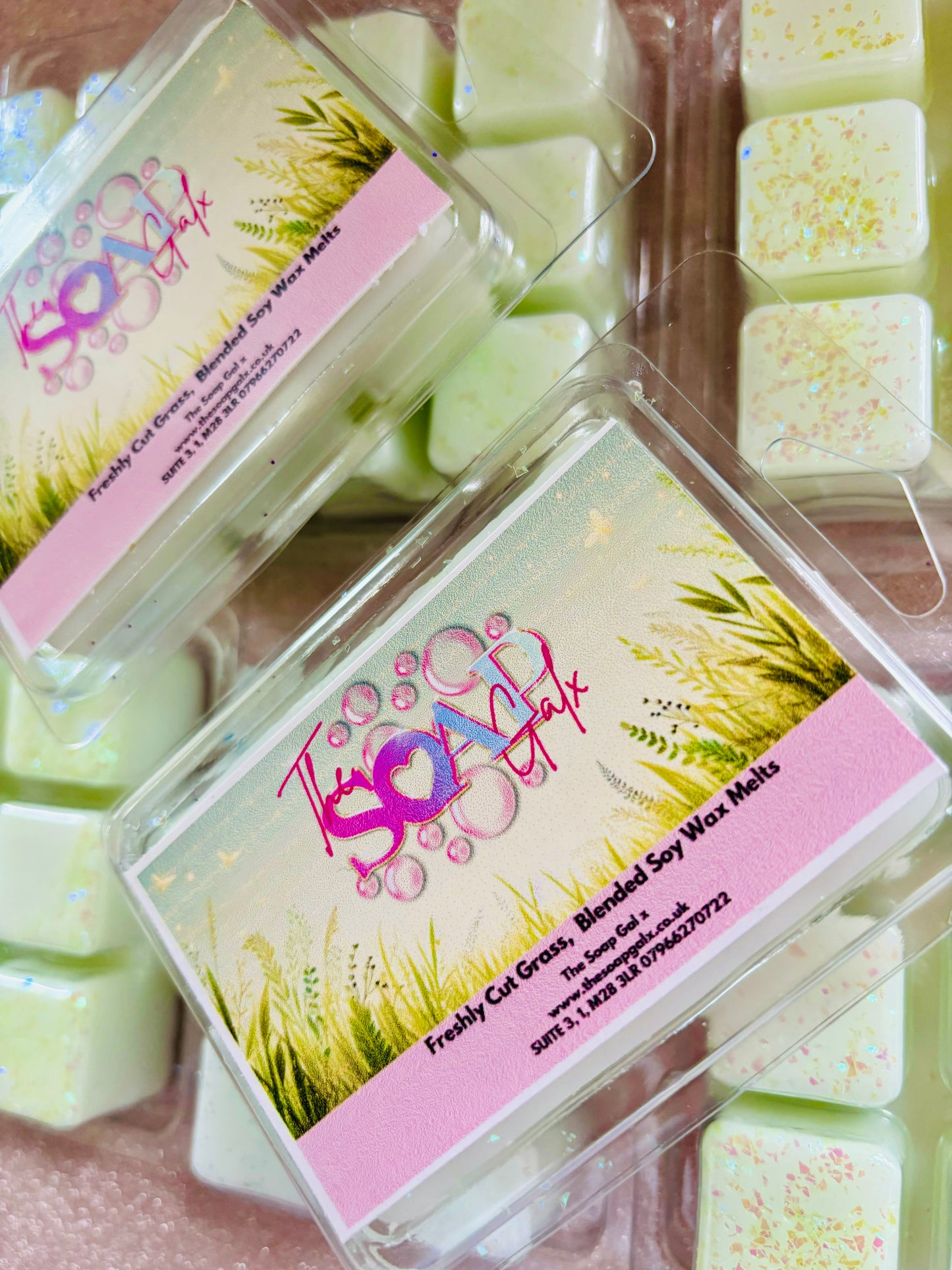 Handmade scented Fresh Cut Grass Wax Melts with packaging, featuring a blend of fresh cut grass and violet notes by The Soap Gal.