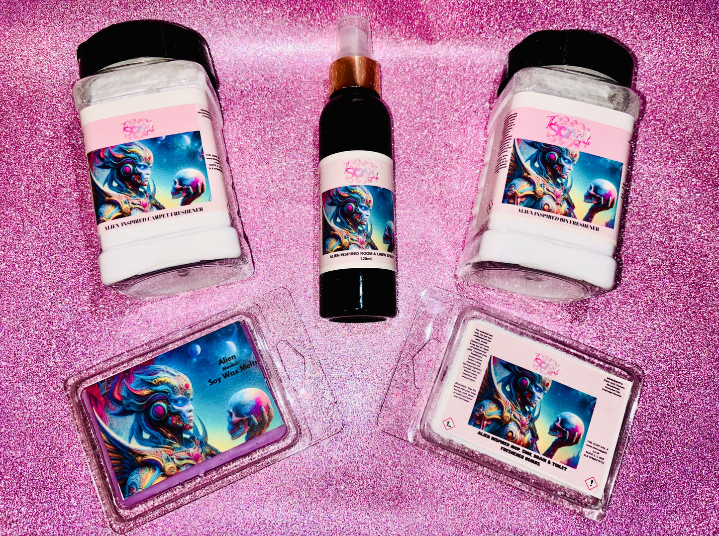 A collection of The Soap Gals' Home Fragrance Cleaning Bundle with a unicorn-themed label design on a glittery pink background.