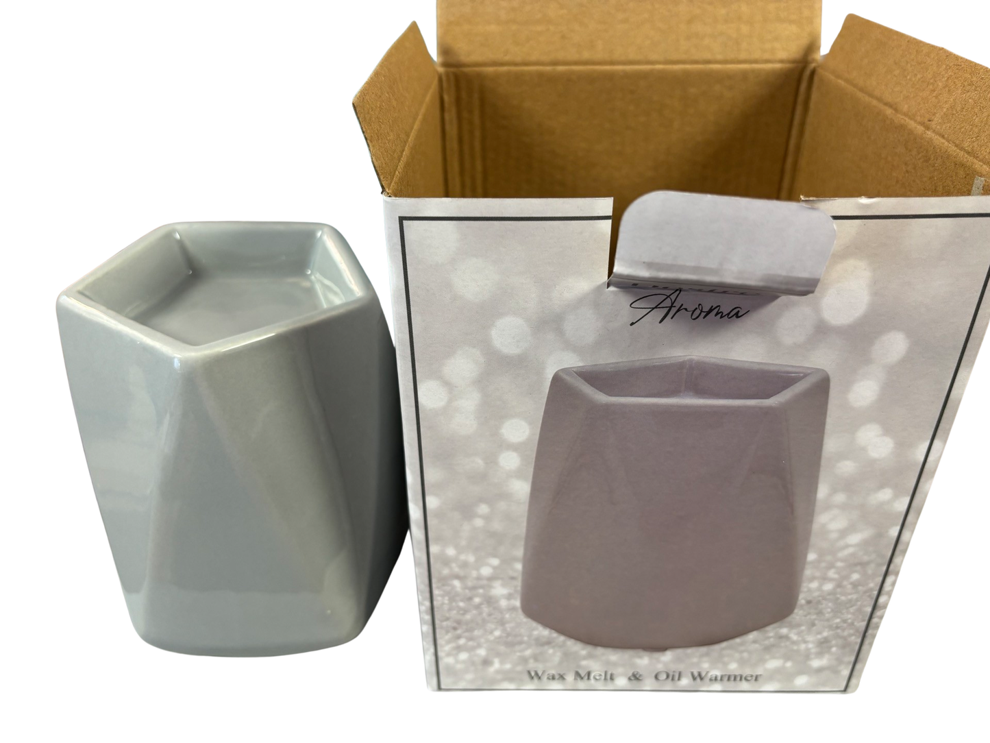 Grey Gloss Wax Melt & Oil Warmer by The Soap Gal x next to its packaging box displaying an image of the product, enhancing your home fragrance experience.