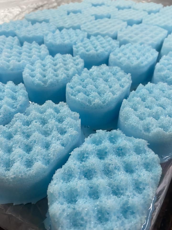 A tray of Men's Aftershave Inspired Soap Sponges from The Soap Gals, sitting on top of a tray.