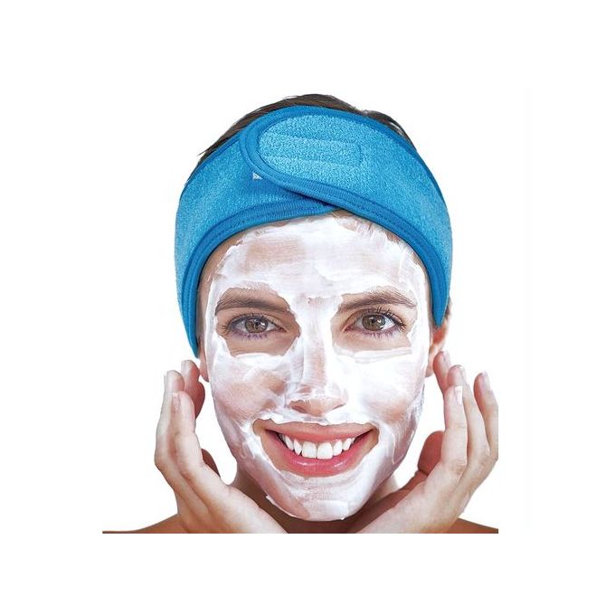 A woman with a Spa Facial Super Soft Make Up Velcro Closure Stretch Towel Headband in microfiber blue from The Soap Gal x on her head.