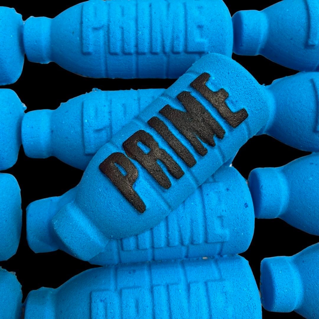 A group of Blue Prime Bottle Bubblegum Bath Bombs, with vibrant look and a sweet scent of Bubblegum from The Soap Gal x.