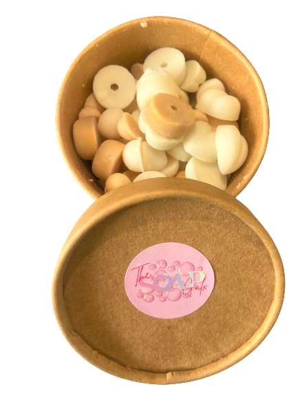 A box filled with a variety of white and brown The Soap Gal x Wax Melt Scoopies 460g.